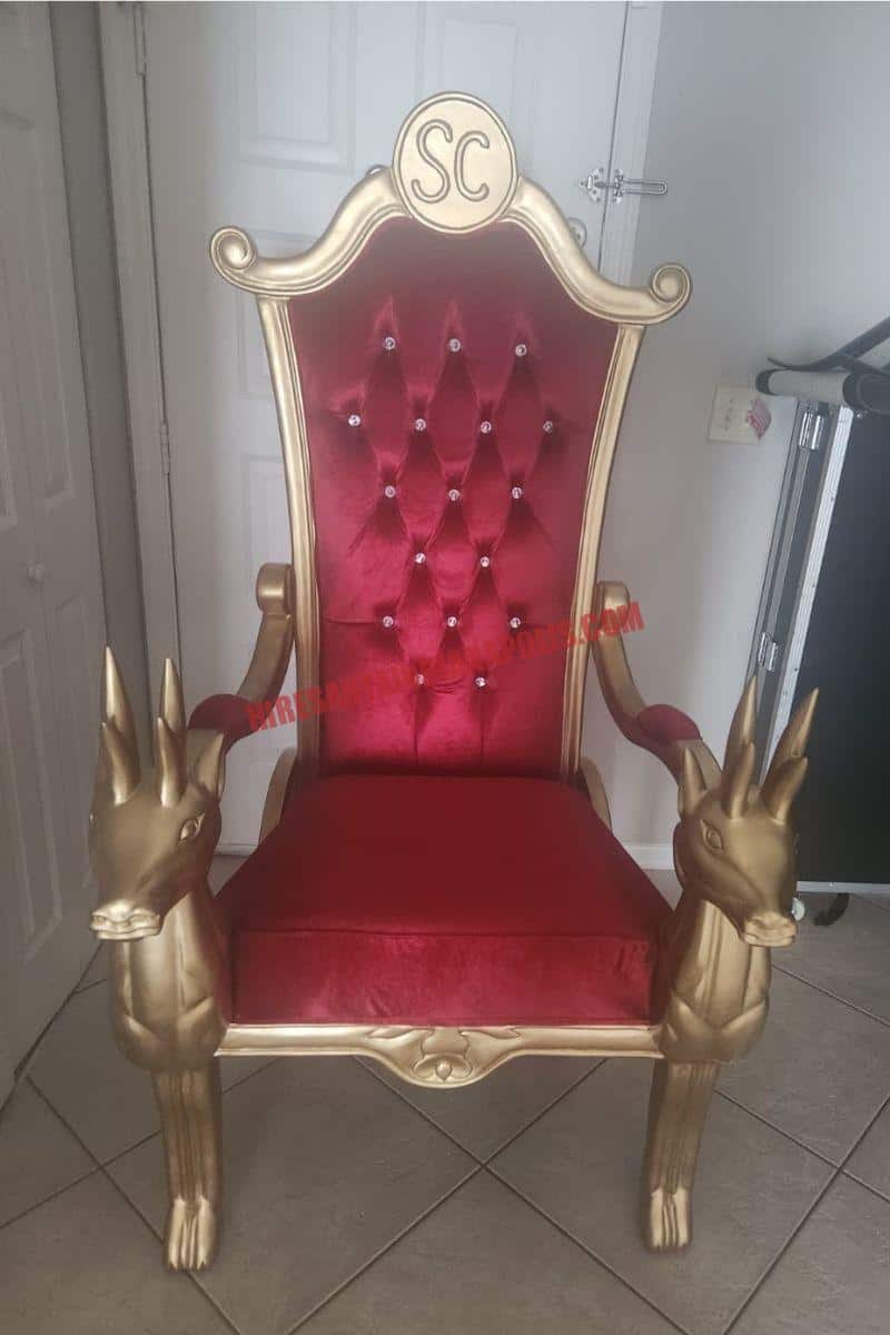 Santa chair photos in Indianapolis: gold chair with a red tufted back and reindeer armrests, set for photos.